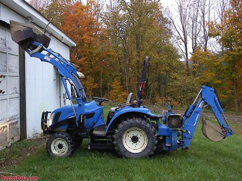 The tool carrier model, the B95C TC, features self-leveling when lifting. . New holland tc29 backhoe attachment